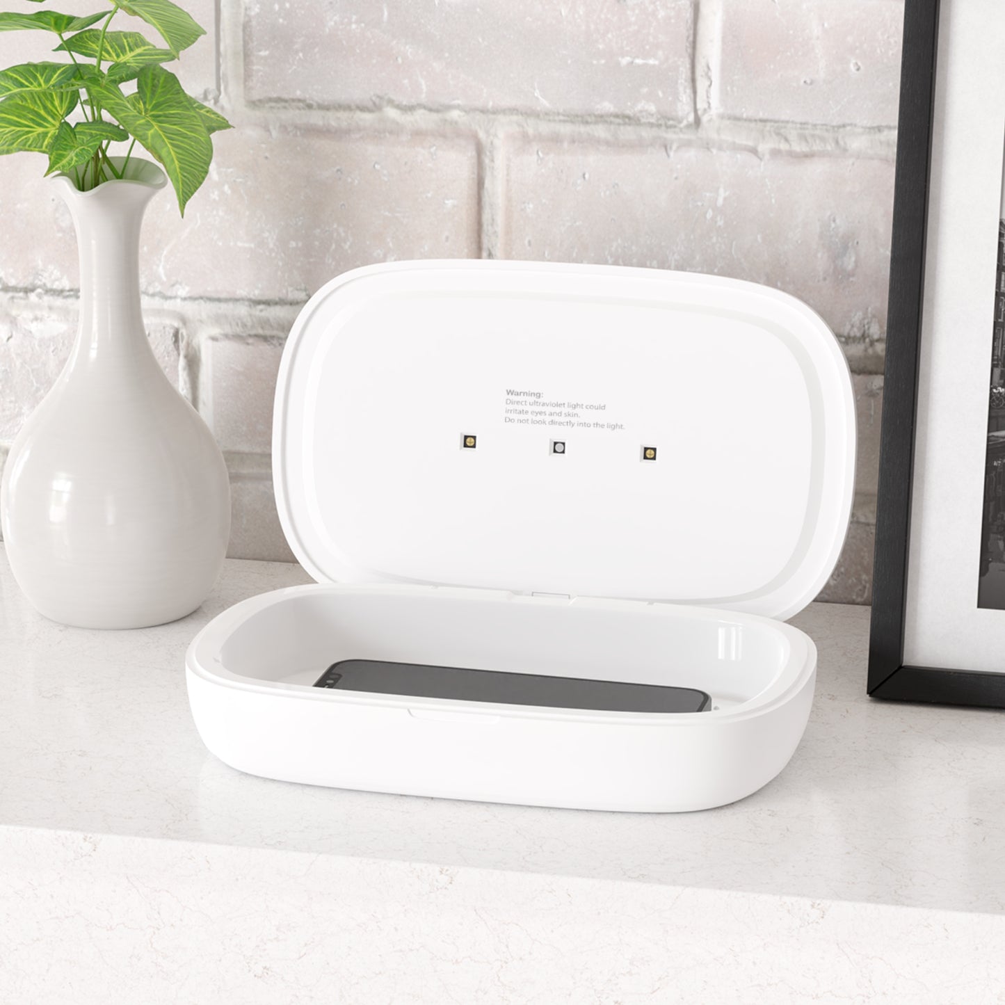 "UV Phone Sanitizer and Wireless Charging Pad"